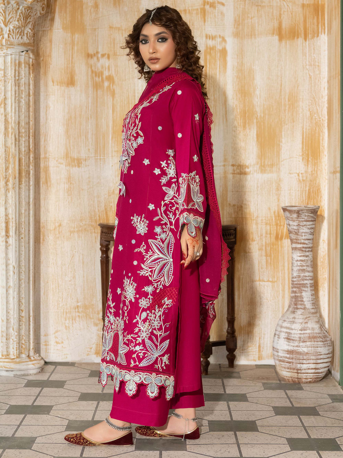 Portrait of model wearing unstitched embroidered lawn suit