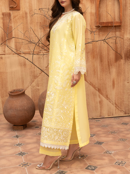 Close-up of embroidered hem on lemon yellow lawn suit