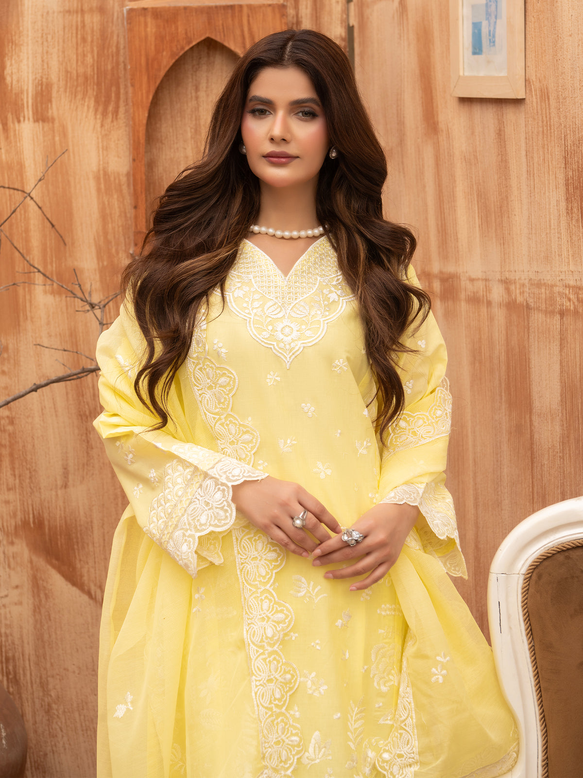 Lemon yellow embroidered lawn suit with dupatta, seated