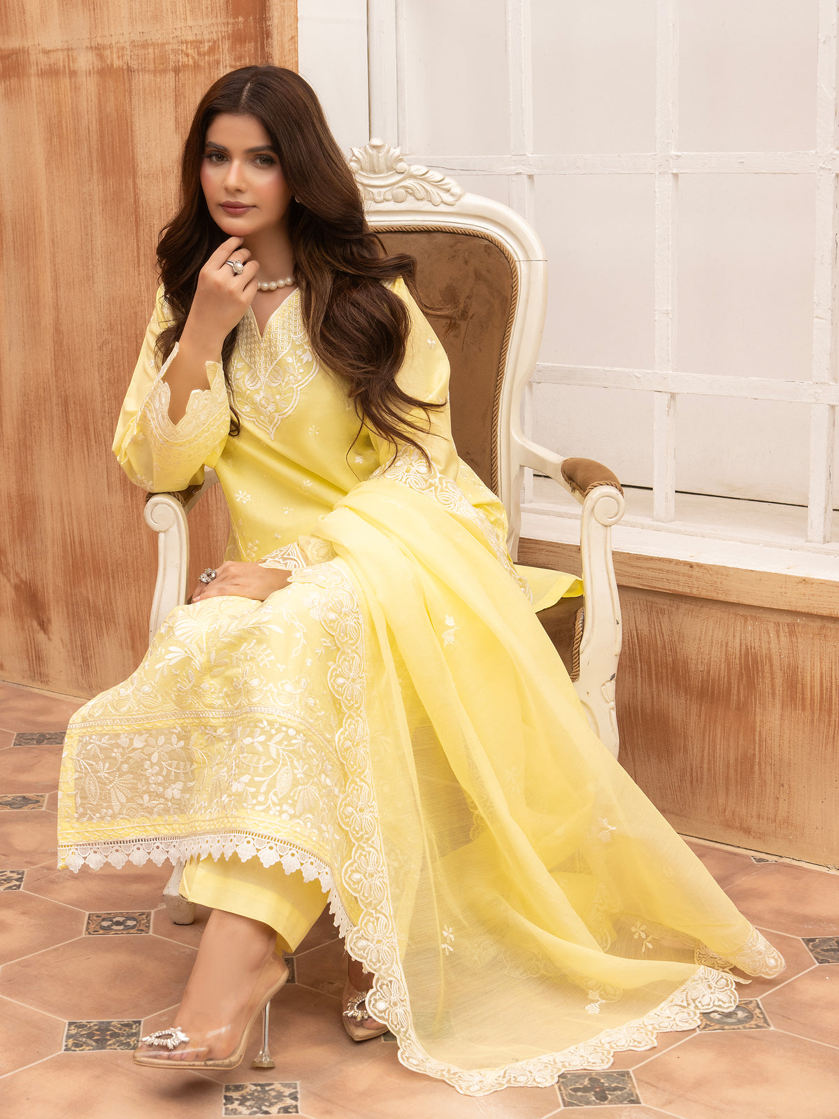 Side view of lemon yellow embroidered lawn suit