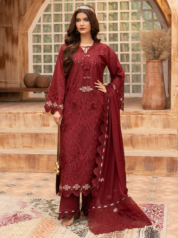 Front view of maroon embroidered lawn suit with gold accessories