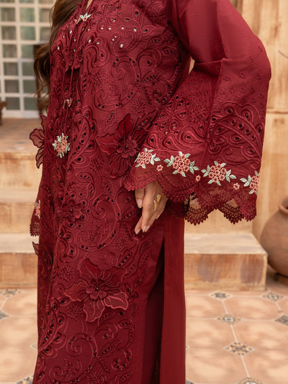 Floral embroidery close-up on maroon lawn suit sleeve