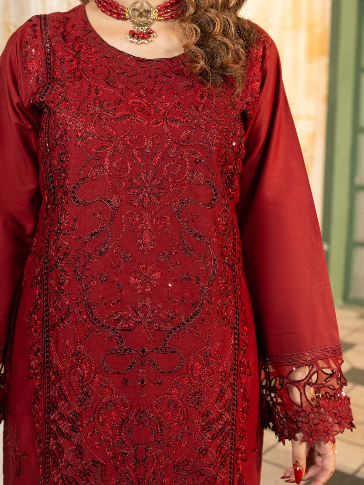 Close-up of embroidered neckline on maroon lawn suit