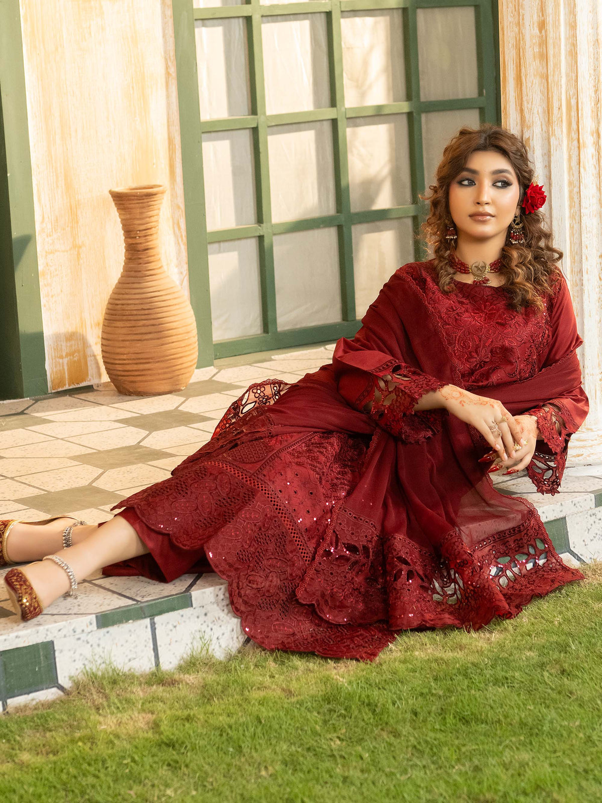 Maroon embroidered lawn suit with chiffon dupatta, seated