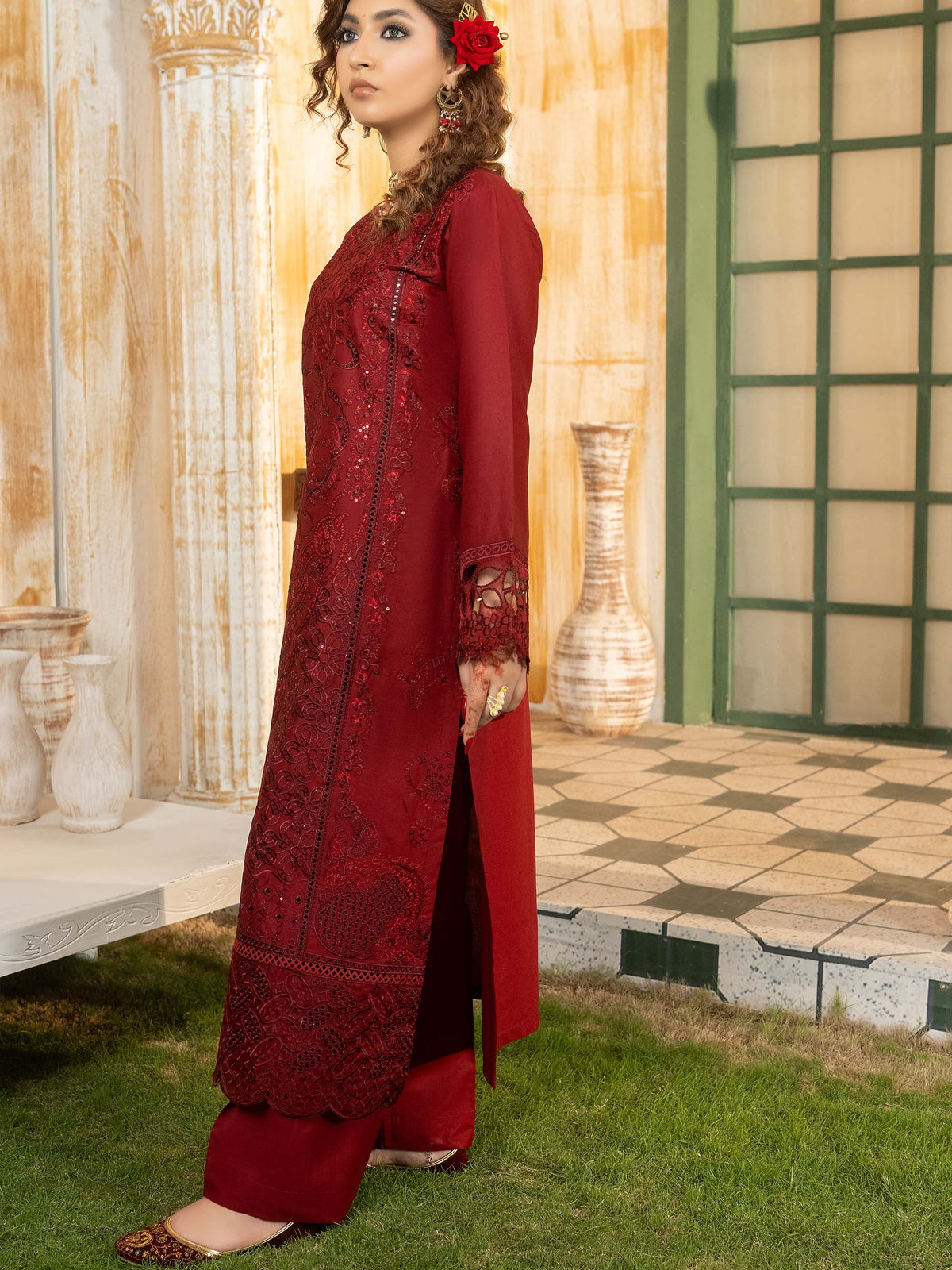 Side profile of maroon embroidered lawn suit