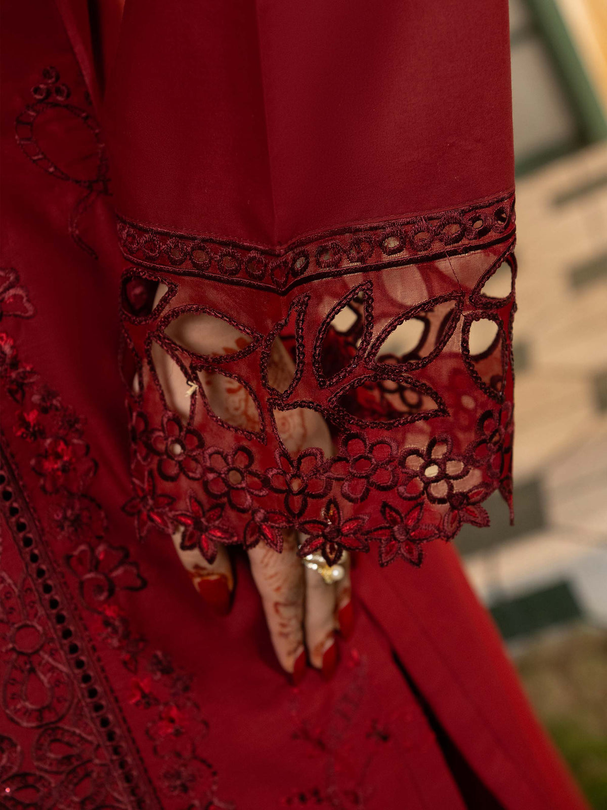 Close-up of cutwork embroidery on suit sleeve