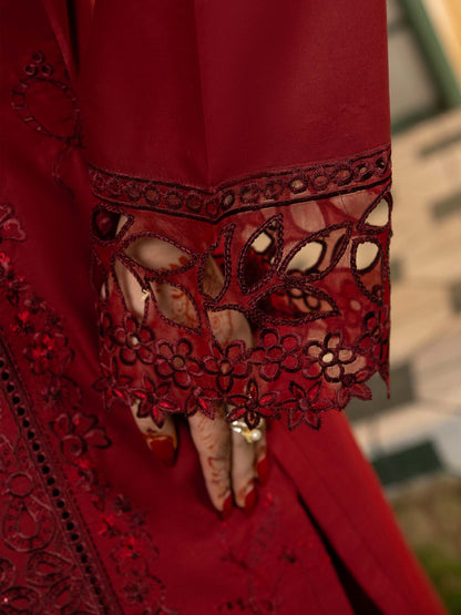 Close-up of cutwork embroidery on suit sleeve