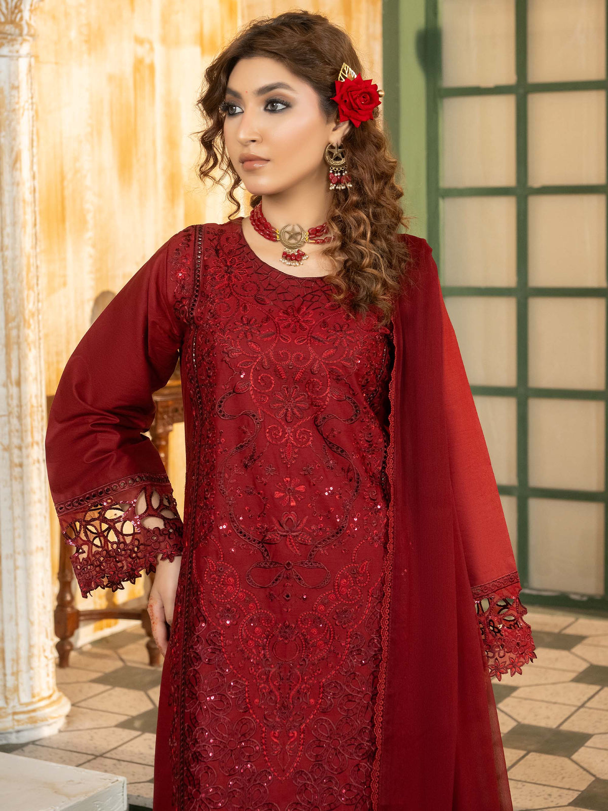Maroon lawn suit styled with jewelry and rose hairpiece