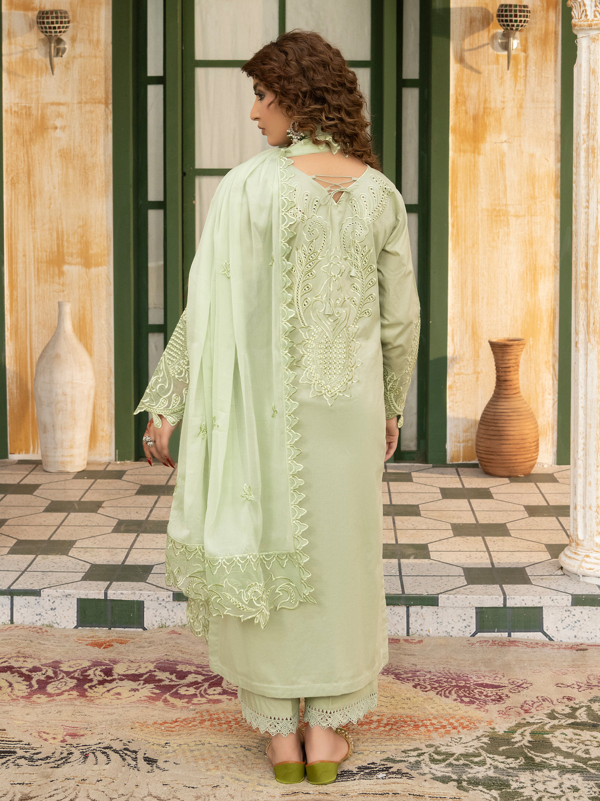 Back view of pista embroidered suit with dupatta