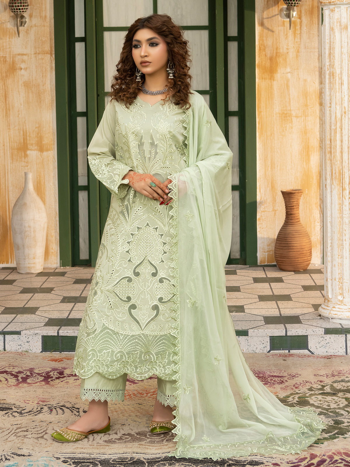 Ladies embroidery suit in pista green, front view