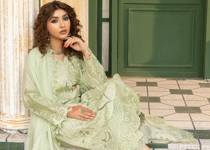 Pista green embroidered suit with net dupatta, seated