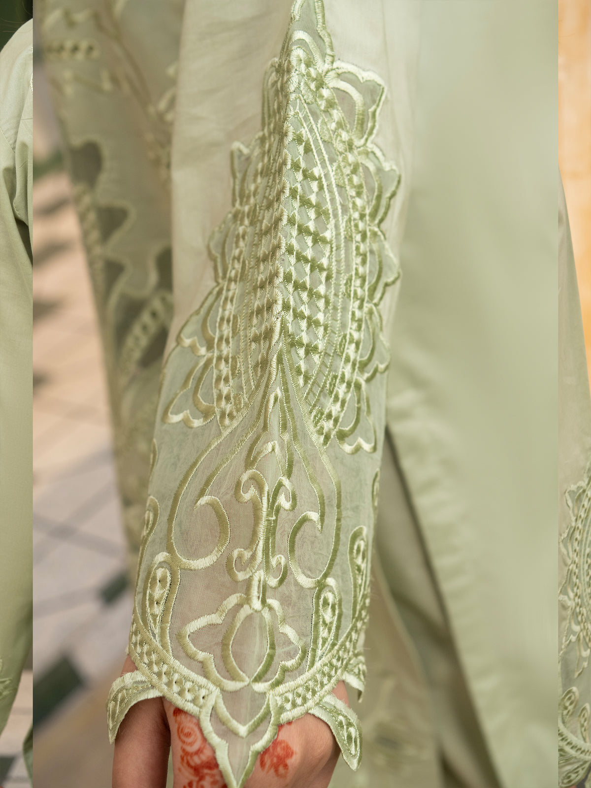 Close-up of sleeve embroidery on ladies suit