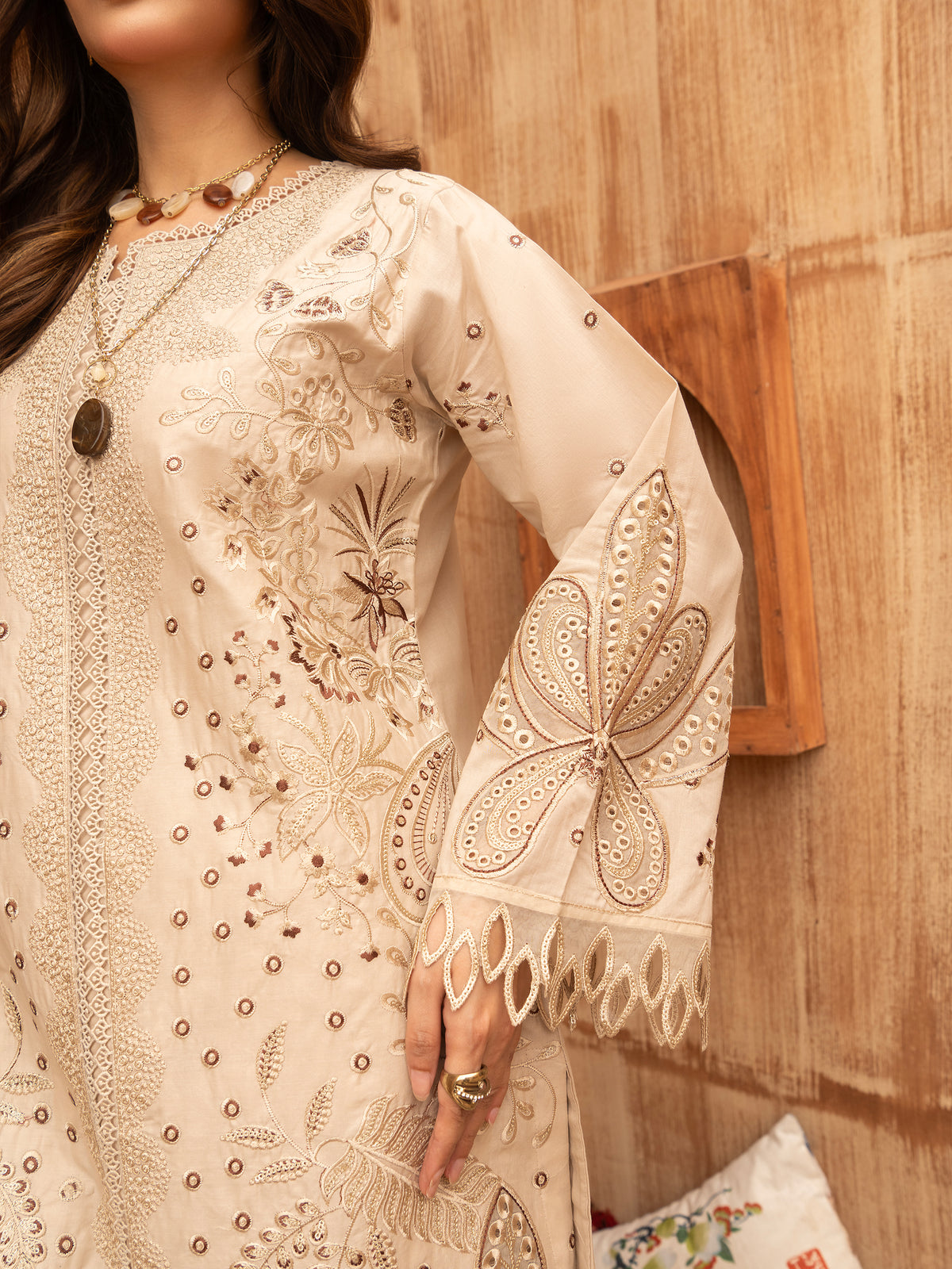 Side profile of beige lawn cotton embroidered dress