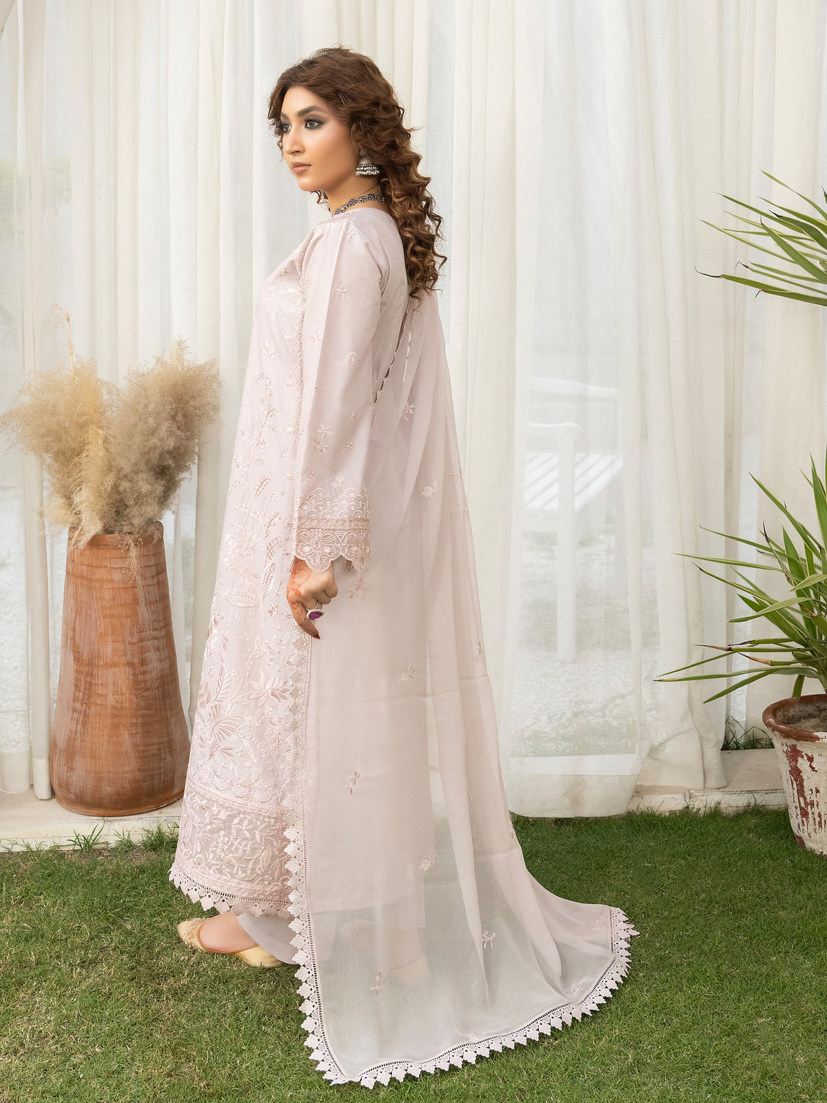 Side profile of beige lawn embroidery dress
