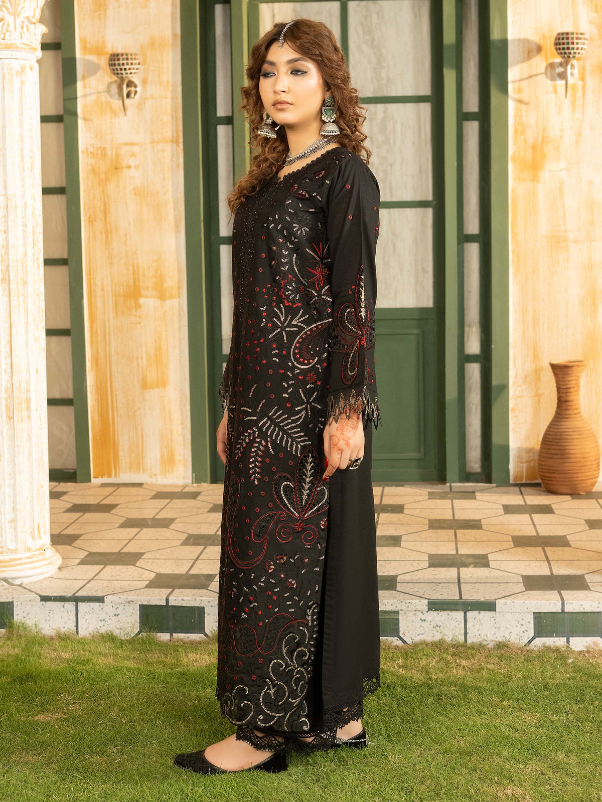 Side profile of black embroidered lawn suit with chiffon dupatta