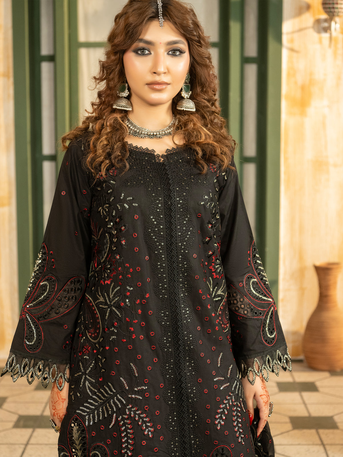 Black lawn suit styled with silver jewelry and chiffon dupatta