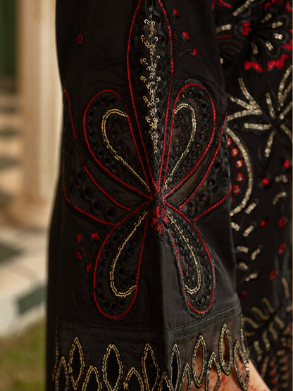 Close-up of cutwork embroidery on suit sleeve