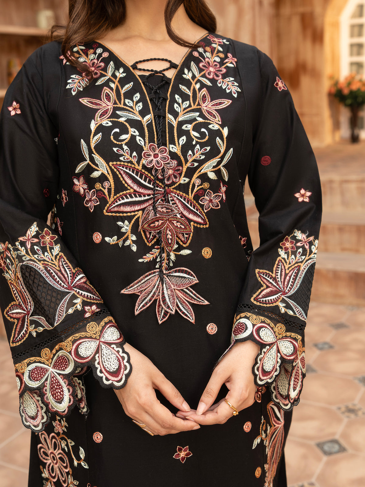 Portrait of model wearing black embroidered lawn suit