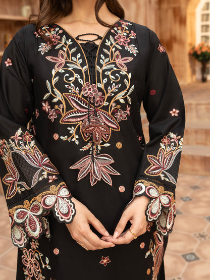 Portrait of model wearing black embroidered lawn suit