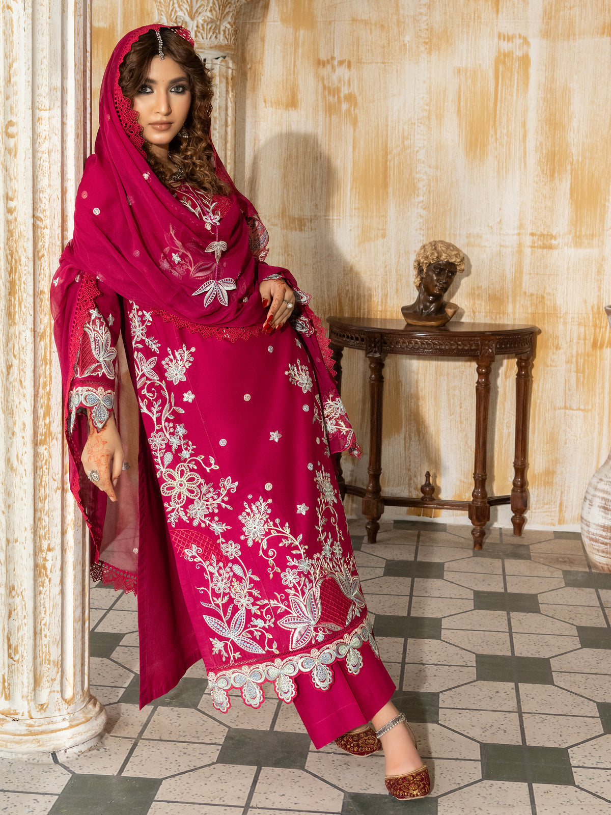 Side view of hot pink unstitched embroidered lawn suit